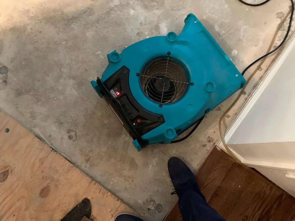 Air mover drying subfloor during Commercial Water Damage Restoration in Loomis